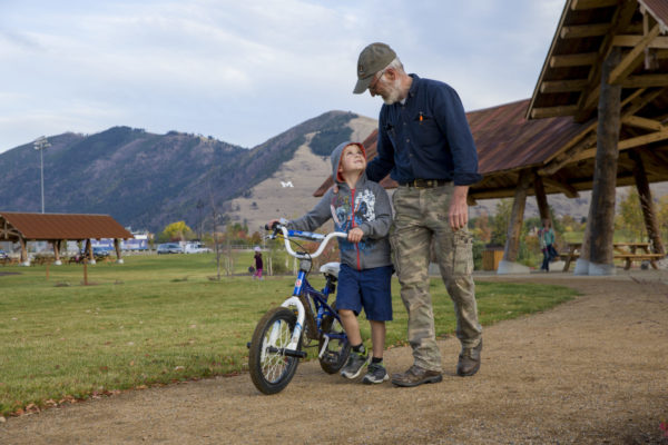 family biking in silver park